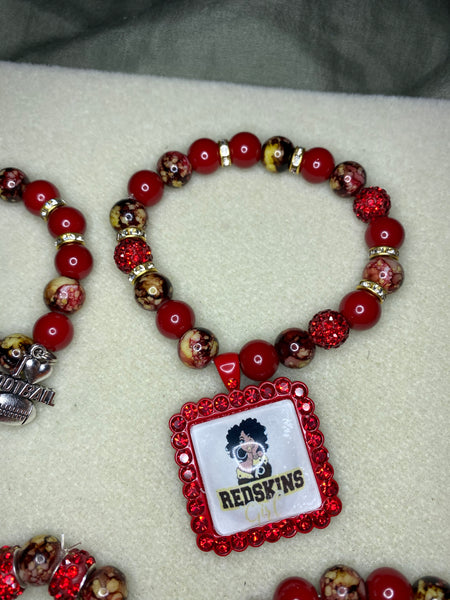 A Set of Redskins beaded bracelets